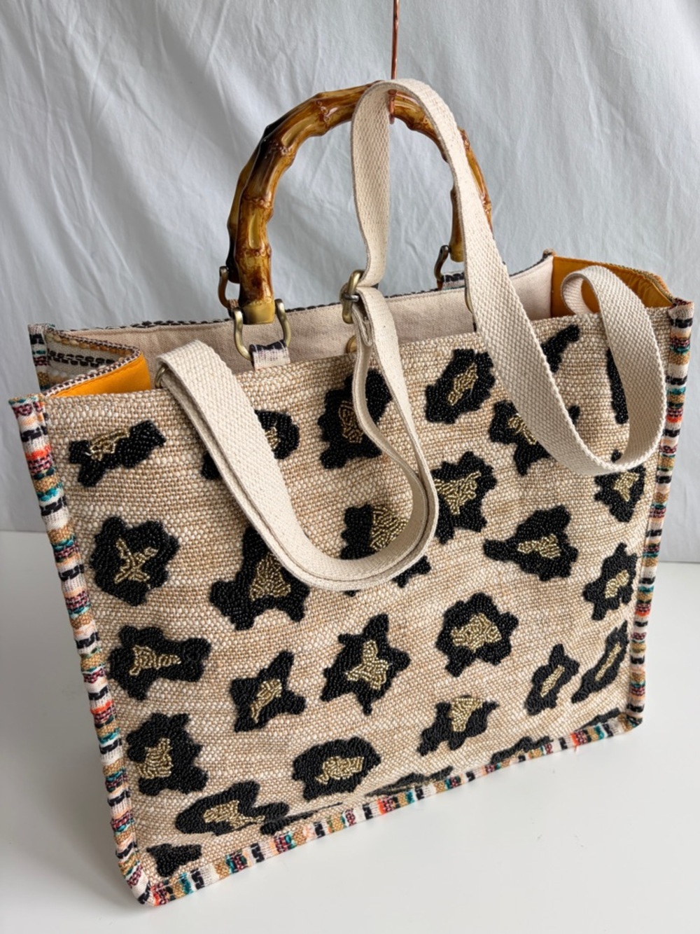 America & Beyond Luxe Leopard Tote Bag
Beaded Bamboo Handles Beige/Black/Orange - Picture 6 of 17